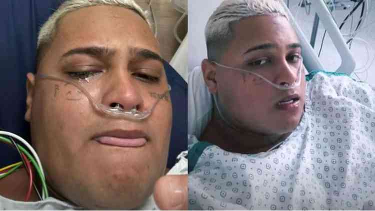 MC Ryan, homem pardo com cabelo descolorido e tatuagens pelo rosto e corpo em hospital acamado com oxignio 