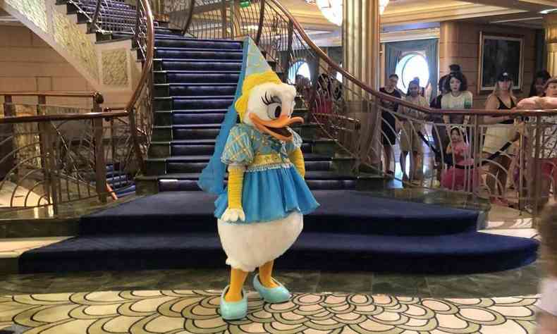 A man dressed as Daisy on a cruise where passengers travel with Disney characters 