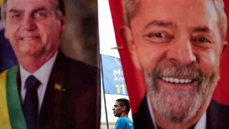 imagem mostra bandeiras com rostos de Bolsonaro e Lula lado a lado
