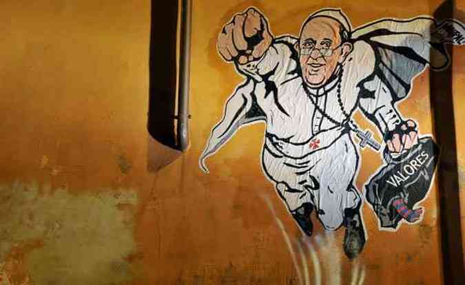 Foi feito um grafite do papa Francisco em muro perto do Vaticano, na cidade de Roma. A Santa S alm de aprovar, at publicou foto em sua conta do Twitter @PCCS_VA(foto: TIZIANA FABI / AFP)