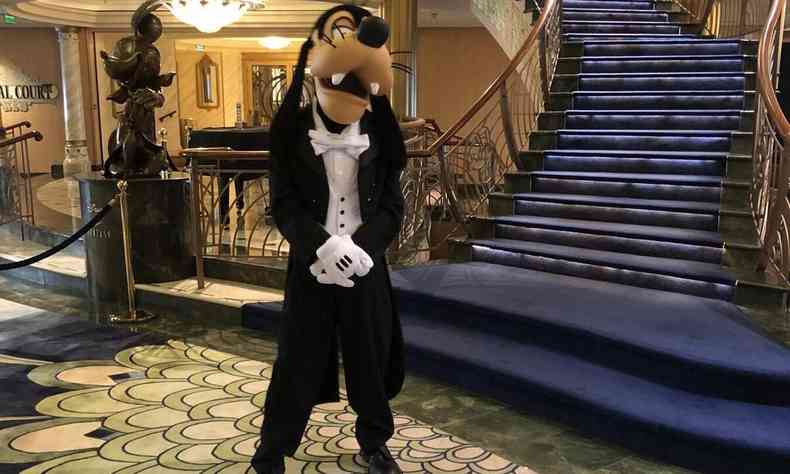 A man dressed as Goofy on a cruise where passengers travel with Disney characters 