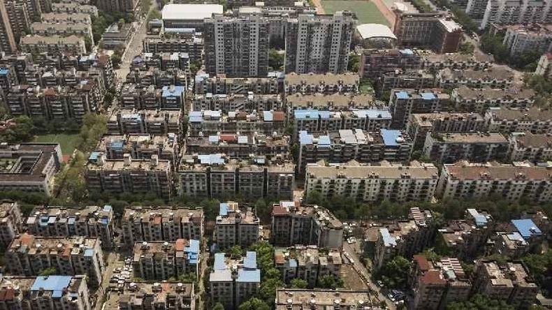 Conjuntos residenciais em Wuhan: no momento do lockdown, calcula-se que milhares já estavam infectados(foto: AFP) Conjuntos residenciais em Wuhan: no momento do lockdown, calcula-se que milhares já estavam infectados(foto: AFP)