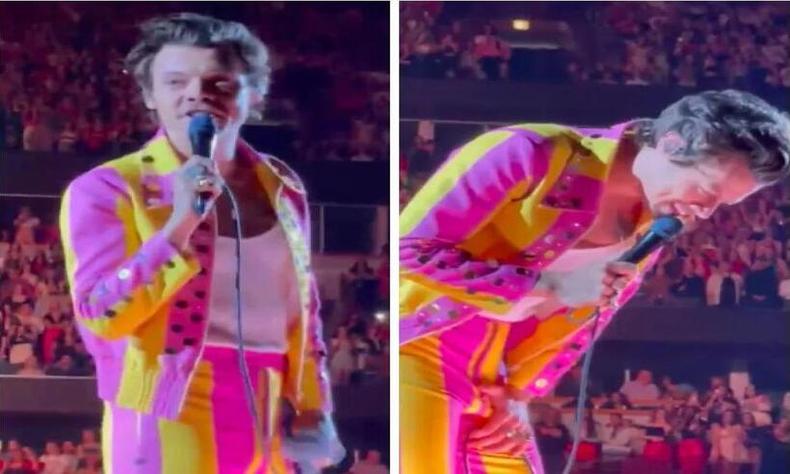 Harry contorcido de dor, com a mo na virilha