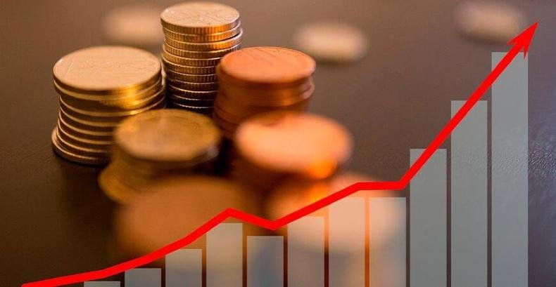 Ilustra��o mostra moedas e curva de gr�fico