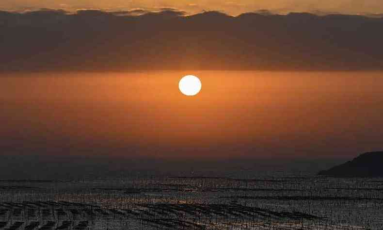 amanhecer no pntano de Xiapu encanta turistas e amantes da fotografia(foto: HECTOR RETAMAL / AFP)