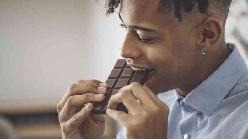 man eating chocolate