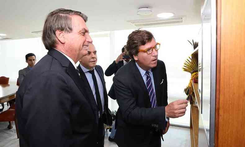 Tucker Carlson e Bolsonaro no Planalto