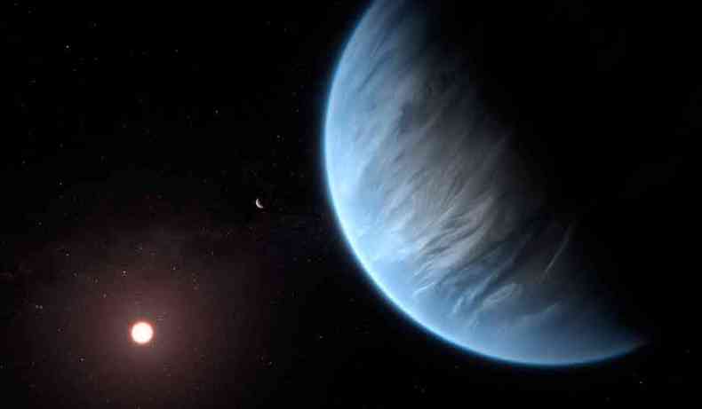 Representao artstica do K2-18b: planeta (esquerda) orbita sua estrela em uma zona habitvel, fora do Sistema Solar (foto: M. Kornmesser/ESA/Hubble /AFP)