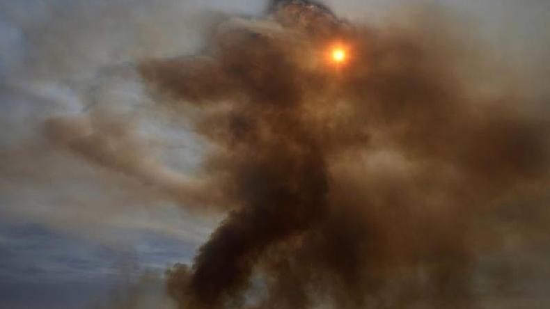 Fumaa em Braslia, em meio  baixa umidade, em foto de junho; maior parte do Brasil poder ter secas mais longas e chuvas mais curtas(foto: Reuters)