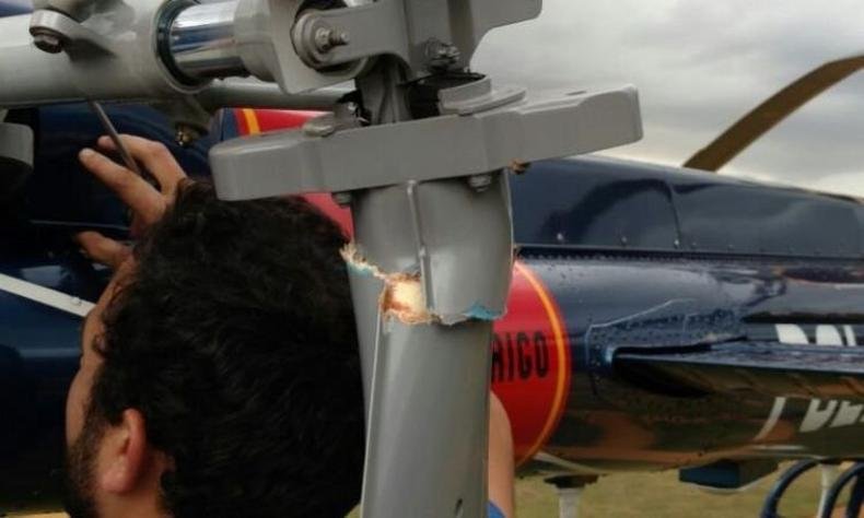Pás do rotor tiveram que ser trocada no local do pouso para liberar aeronave para voo(foto: PMMG/Divulgação) Pás do rotor tiveram que ser trocada no local do pouso para liberar aeronave para voo(foto: PMMG/Divulgação)