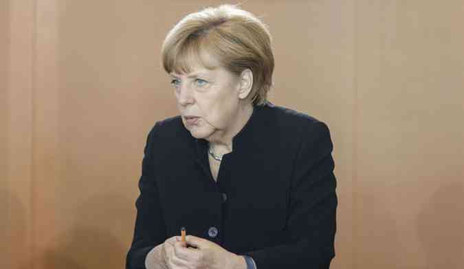 Primeira ministra alem Angela Merkel. Salrio mnimo  promessa a ser paga por aliana de social-democratas na eleio(foto: AFP PHOTO / CLEMENS BILAN )
