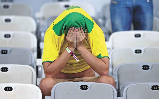 Inesperado e surpreendente, o 7 a 1 desolou a torcida que lotou as disputadas cadeiras do Gigante da Pampulha (foto: Rodrigo Clemente/EM) Inesperado e surpreendente, o 7 a 1 desolou a torcida que lotou as disputadas cadeiras do Gigante da Pampulha (foto: Rodrigo Clemente/EM)