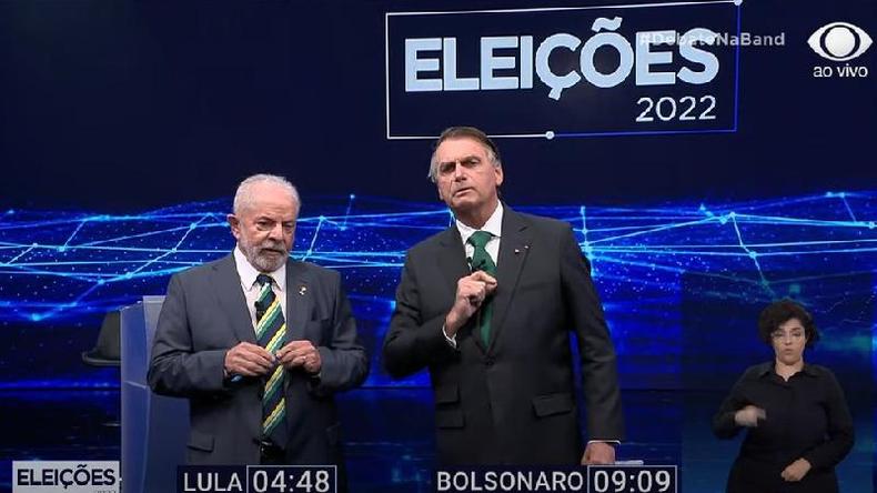 Durante debate, Lula e Bolsonaro usaram maior parte do tempo para falar sobre pandemia, fake news e corrupção(foto: Reprodução/TV Bandeirantes) Lula e Bolsonaro durante debate na Band