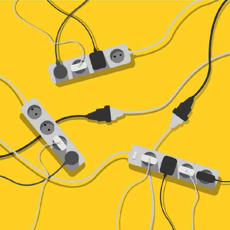 Uma confuso de cabos de vrios cabos de extenso, fios eltricos e carregadores em um fundo amarelo