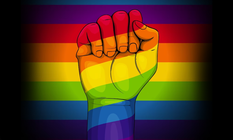 ilustrao de um punho fechado erguido em um fundo com as cores da bandeira LGBT