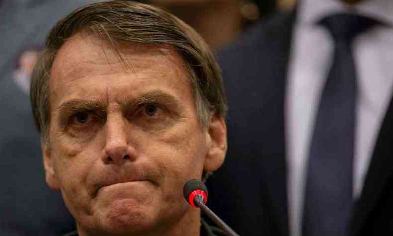 Bolsonaro evitou comentar diretamente gravao de seu filho: 'Desconheo esse vdeo. Duvido. Algum tirou de contexto'(foto: Mauro Pimentel/AFP)