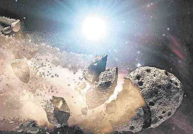 Ilustrao mostra momento em que grande rocha espacial se desintegra: processos como esse do origem s famlias de asteroides. Estudo sobre o tema  trabalhoso(foto: NASA/REUTERS - 20/9/11)