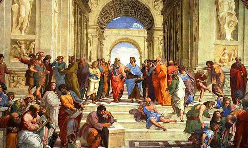 Obra Prima de Rafael Sanzio. Ao centro e ao alto, Platão à esquerda, usando toga vermelha, dialoga com Aristóteles, vestindo uma toga azul. Note que Platão aponta para cima, para 