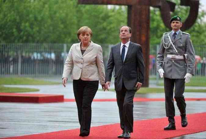 Novo presidente francs se encontrou nesta tera com Angela Merkel em Berlim(foto: BERTRAND LANGLOIS / AFP)