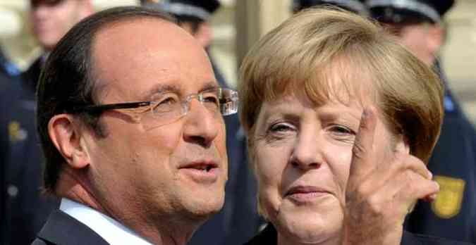 O presidente francs Franois Hollande e a chanceler alem Angela Merkel celebram na noite desta segunda-feira os 50 anos do armistcio(foto: THOMAS KIENZLE / AFP)