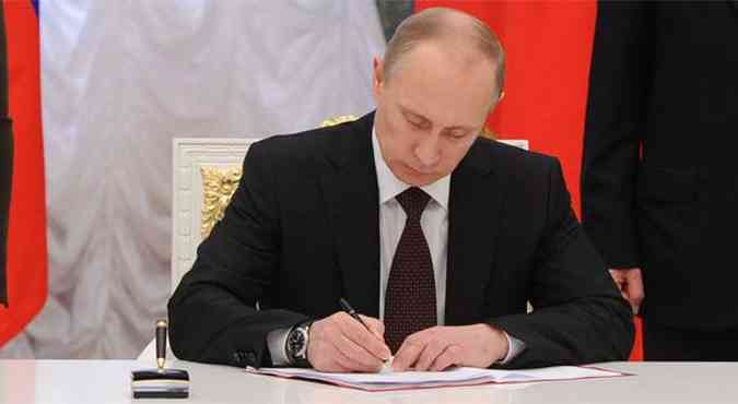 Putin ignora presso internacional e ratifica anexao da Crimeia(foto: AFP PHOTO/ RIA-NOVOSTI/ POOL / MIKHAIL KLIMENTYEV )