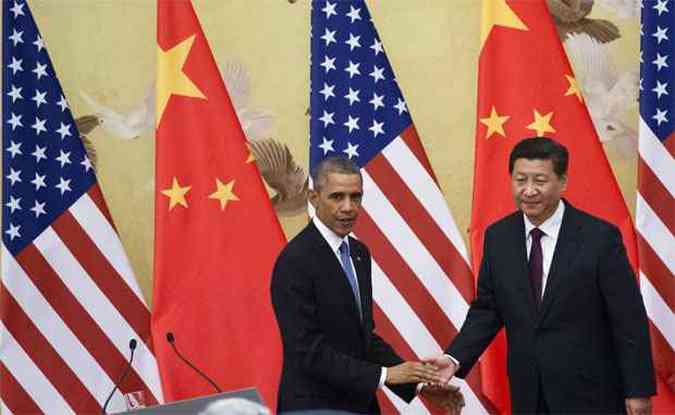 Barack Obama e Xi Jinping selam acordo durante encontro em Pequim (foto: AFP PHOTO / Mandel NGAN )