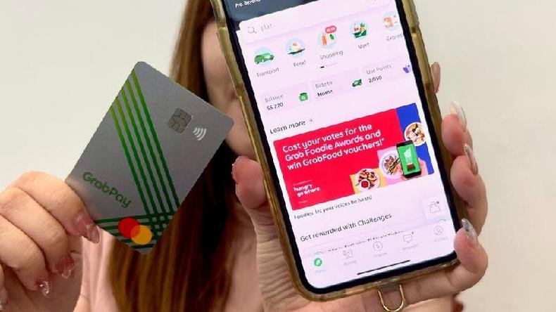 Você pode obter um cartão físico do Grab vinculado a uma conta bancária(foto: BBC) Cartão do Grab